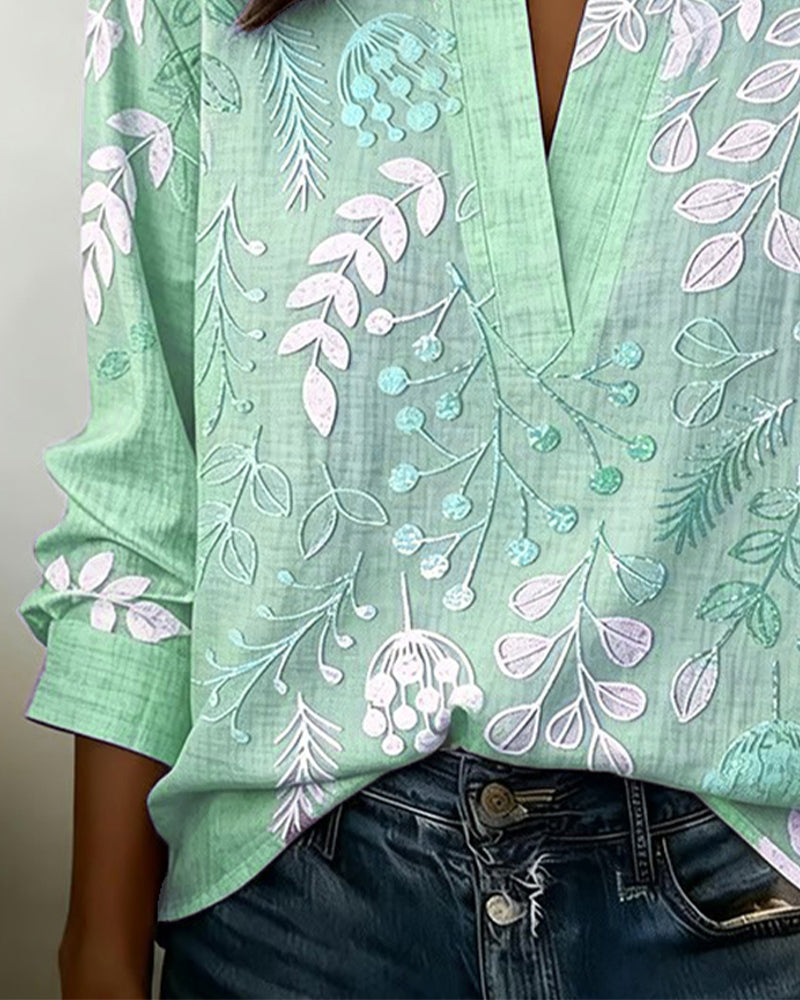 Blus dam blommig pastell med V-ringning och lätt andningsbart tyg