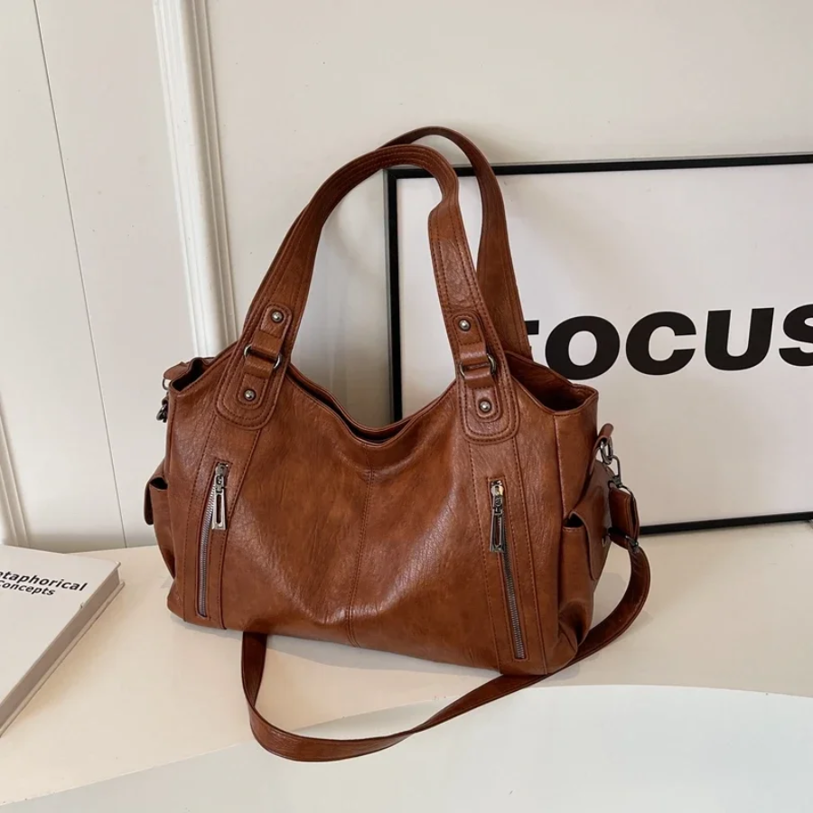 Axelväska dam crossbody med metalldetaljer och flera fack