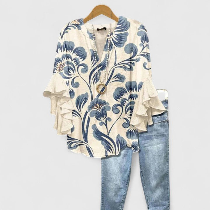 Blus dam med blommigt tryck och volangärmar i stor storlek