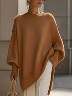 Stickad tröja dam oversize med asymmetrisk fåll och ribbade muddar