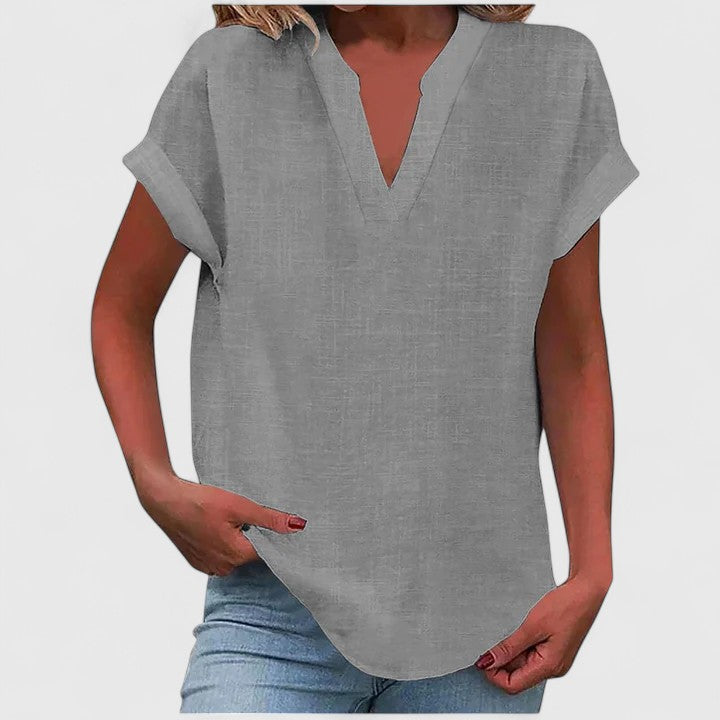 Blus dam kortärmad med V ringad hals och texturerad yta