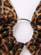 Paljettblus dam leopardmönstrad crop top med halterhals och metalldetalj