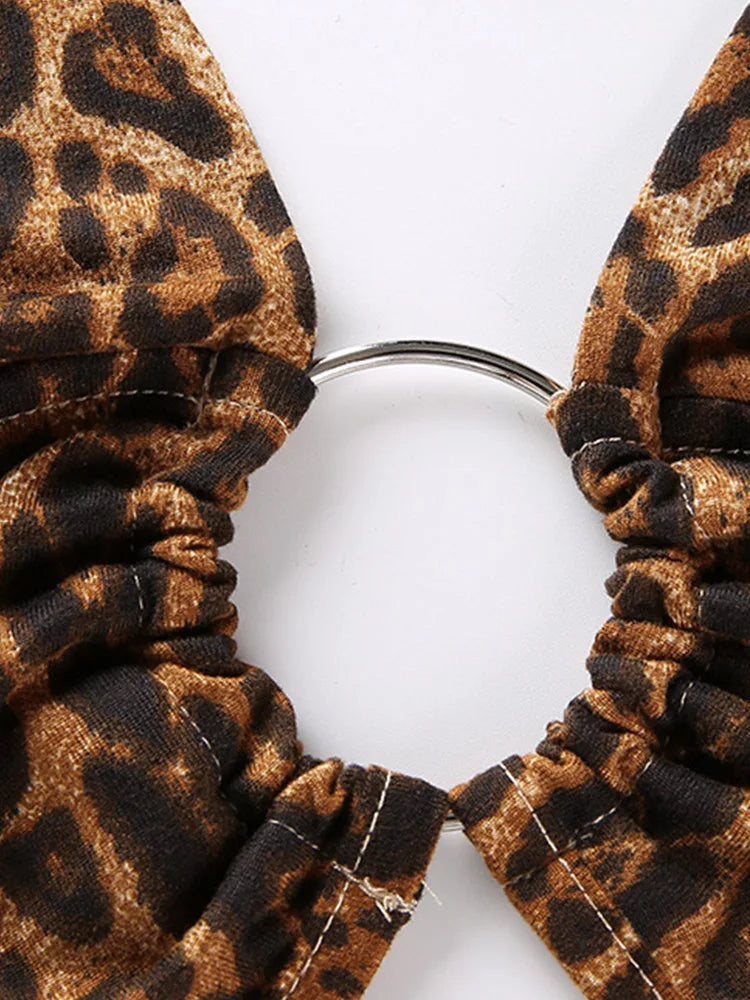 Paljettblus dam leopardmönstrad crop top med halterhals och metalldetalj