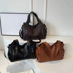 Crossbody väska dam med mjuk form och lång axelrem