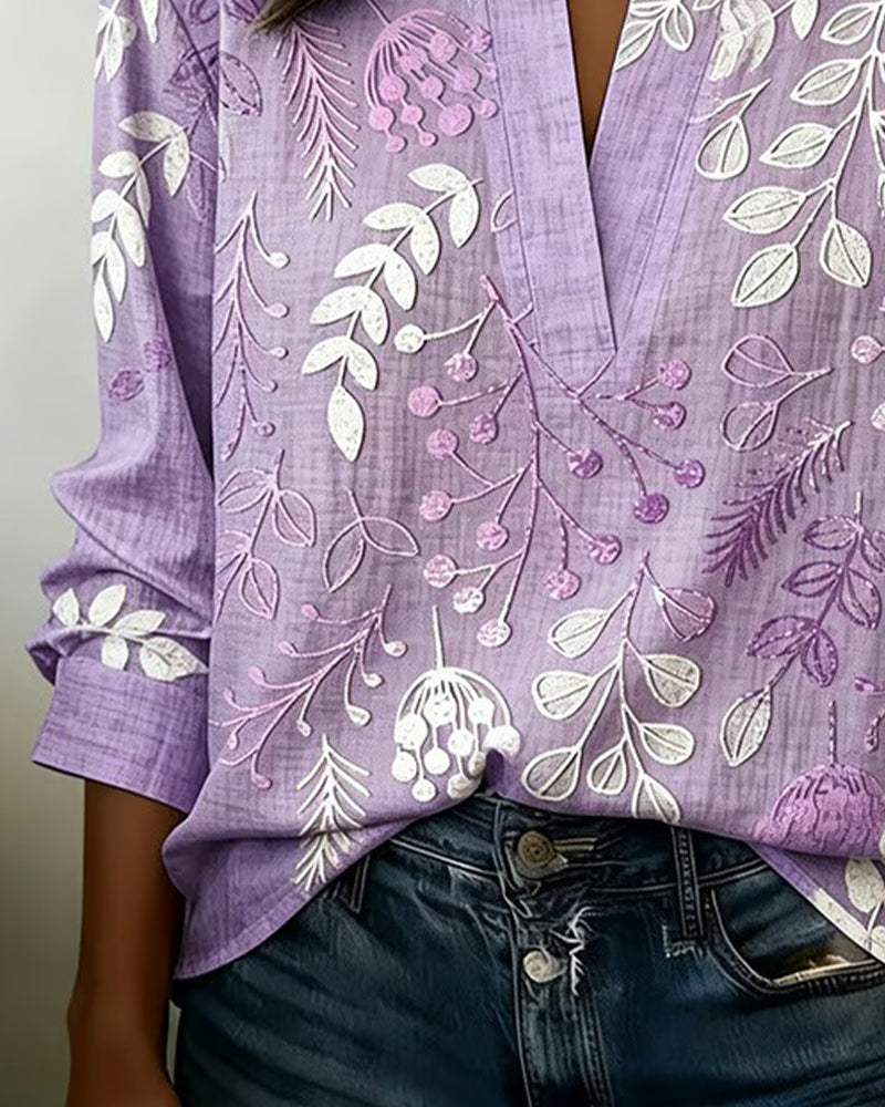Blus dam blommig pastell med V-ringning och lätt andningsbart tyg