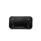 Läderväska dam i äkta läder med flera innerfack och guldbeslag
