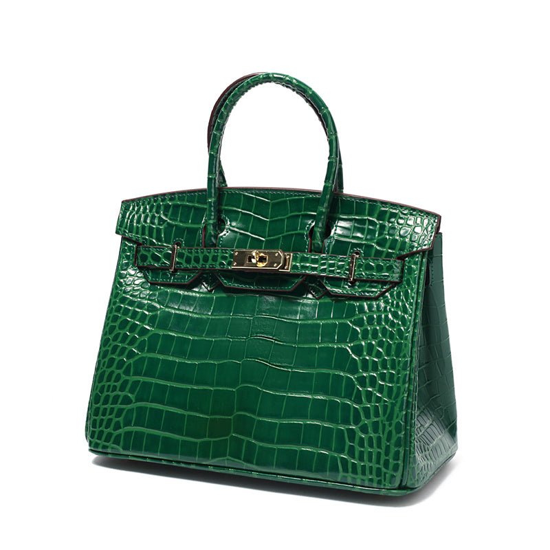 Läderväska dam i äkta läder med flera innerfack och guldbeslag
